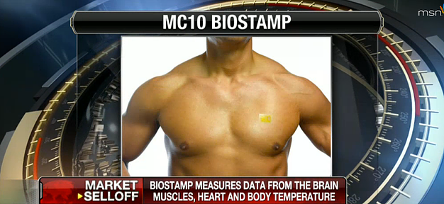 News broadcast screenshot showing a torso with an MC10 BioStamp sensor applied, with on-screen text reading 'BioStamp measures data from the brain, muscles, heart and body temperature.