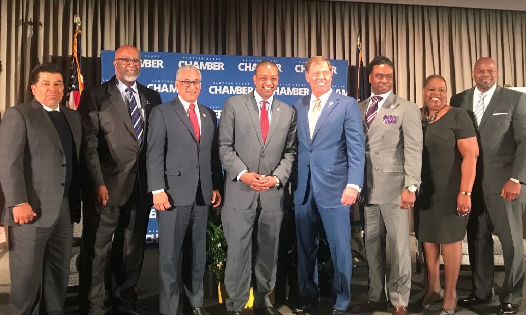 Group of speakers and panelists from the Diversity in Business Forum posed together in front of a Hampton Roads Chamber backdrop.