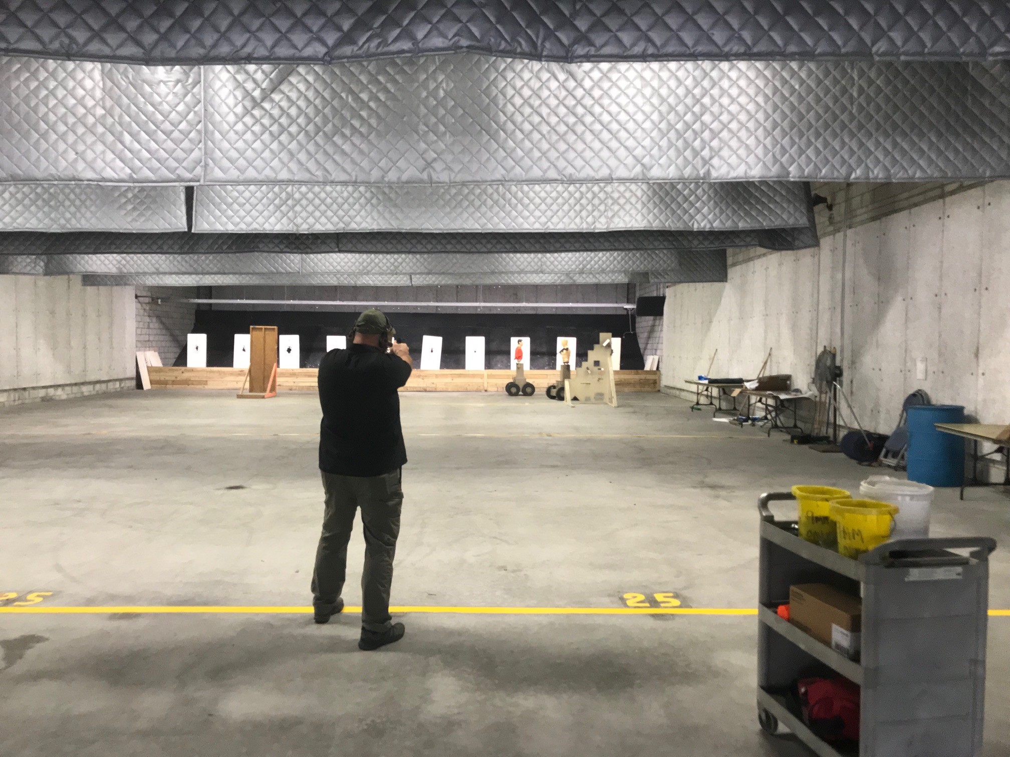An officer aims at HTT targets on the indoor firing range at the Coral Springs Police Department demonstration.